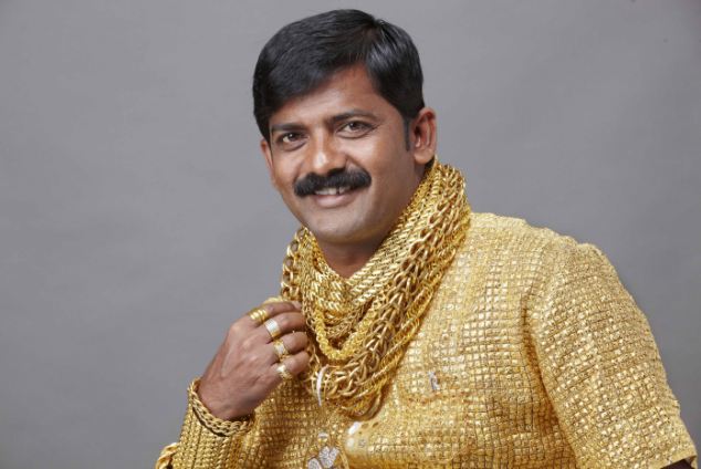 GOLD MINGER Wealthy Datta Phuge has splashed out 14,000 GBP on a solid gold shirt to make sure he's a 24 karat hit with women in central India. Money-lender Datta, 32, from Pimpri-Chinchwad, says the shirt took a team of 15 goldsmiths two weeks to make working 16 hours a day creating and weaving the gold threads. It comes complete with its own matching cuffs and a set of rings crafted from left-over gold. "I know I am not the best looking man in the world but surely no woman could fail to be dazzled by this shirt?" he explained. (ends)