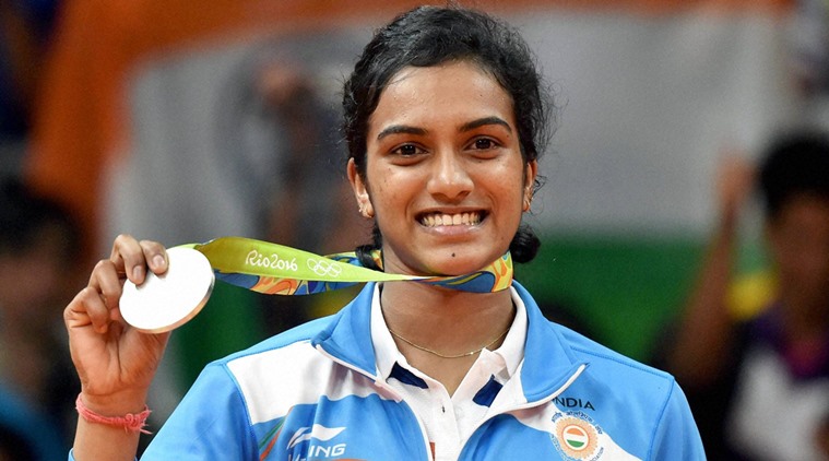 Rio de Janeiro: India's Pusarla V Sindhu poses with her silver medal after her match with Spain's Carolina Marin in women's Singles final at the 2016 Summer Olympics at Rio de Janeiro in Brazil on Friday. PTI Photo by Atul Yadav (PTI8_19_2016_000286b)