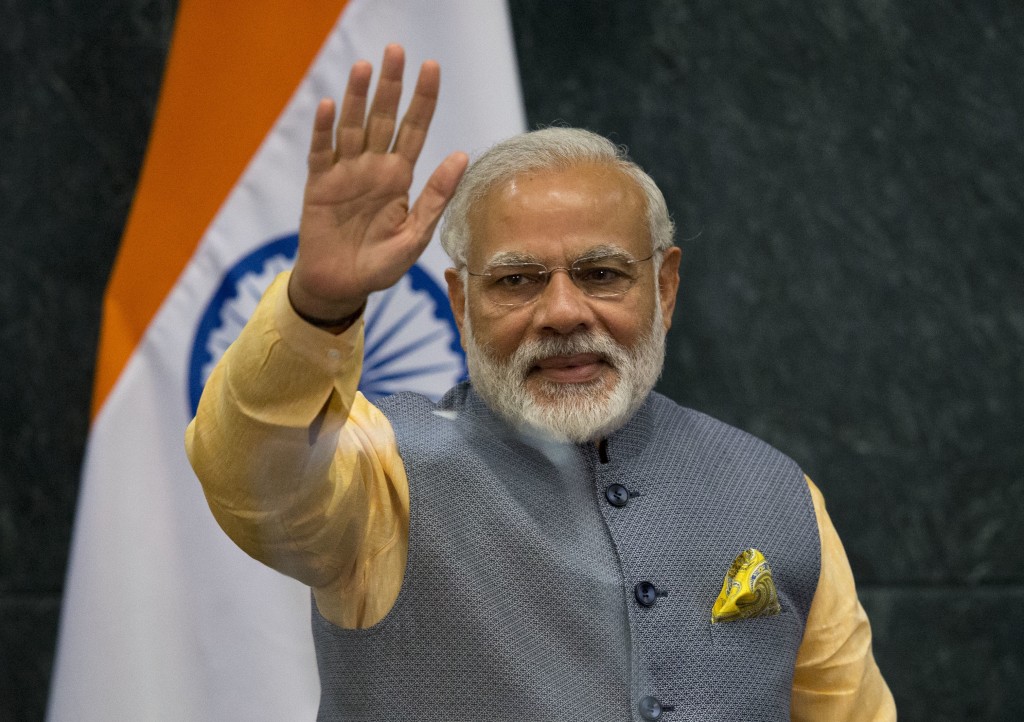 Prime Minister of India Narendra Modi waves following a joint statement to the press with Mexican President Enrique Pena Nieto, in Los Pinos presidential residence in Mexico City, Wednesday, June 8, 2016. Modi met with the Mexican President Wednesday evening during a short working visit to the country.(AP Photo/Rebecca Blackwell)